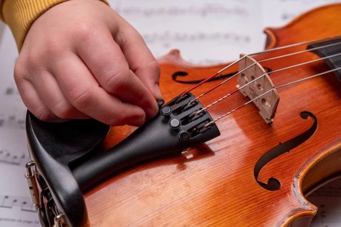 Children's hand tuning viola on the fine tuners, studio recording, Germany, Europe