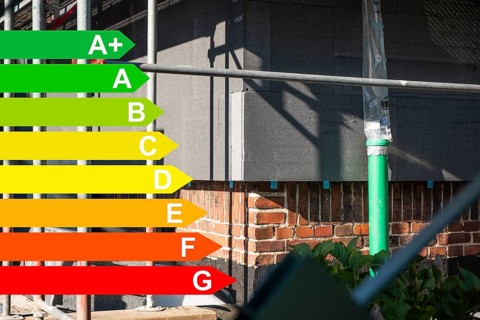 Insulation of a brick house facade with Polystorol insulation boards, graphic with energy