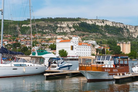 A view of the harbour with various boats and a coastal town, Balchik, Bal?ik, Dobrich, Black Sea,
