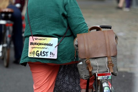 Sign of a demonstrator at the alliance demo on climate racism and climate flight, with, among