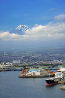 View over the city Fuji and Tagonoura Port with Mount Fuji in the background in spring, Shizuoka