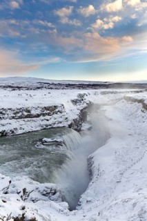 Gullfoss waterfall in the snow in winter located in the canyon of Hvítá river, Haukadalur,