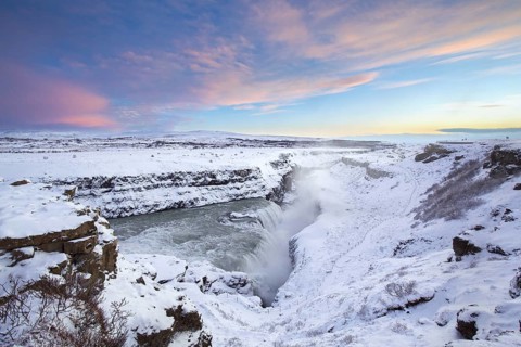 Gullfoss waterfall in the snow in winter located in the canyon of Hvítá river, Haukadalur,