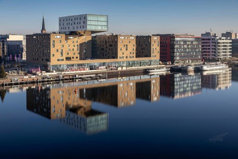 Design hotel nhow, next to Coca-Cola Germany in a red building, reflection of the Spree, former