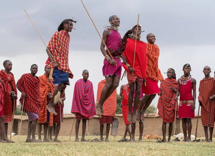 Maasai people preforming the traditional jumping dance in a Maasai village in Maasai Mara, Kenya,