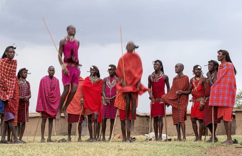 Maasai people preforming the traditional jumping dance in a Maasai village in Maasai Mara, Kenya,