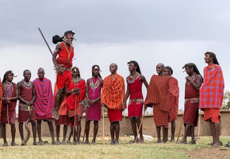 Maasai people preforming the traditional jumping dance in a Maasai village in Maasai Mara, Kenya,