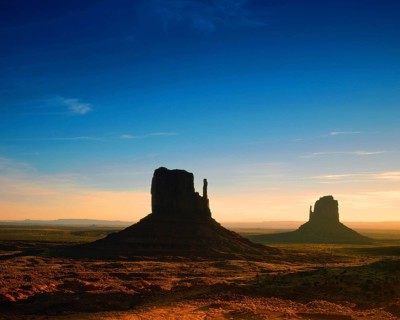 Elephant Butte seen across the desert-floor with thorn-scrub, other buttes in distance, Monument
