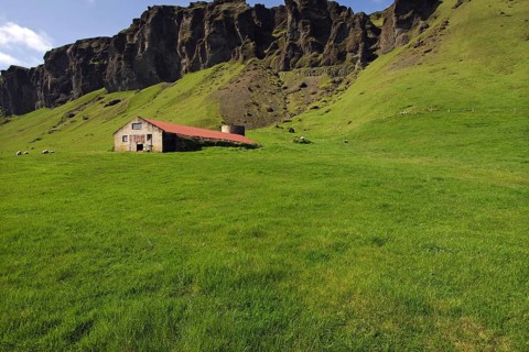 Barn or sheep-shed beneath basalt crags near the farming township of Foss, southern Iceland