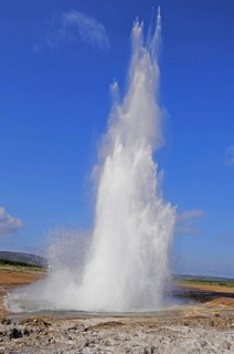 The geyser Strokkur fires steam and boiling water up to a height of around 20m, at Storr Geysir,
