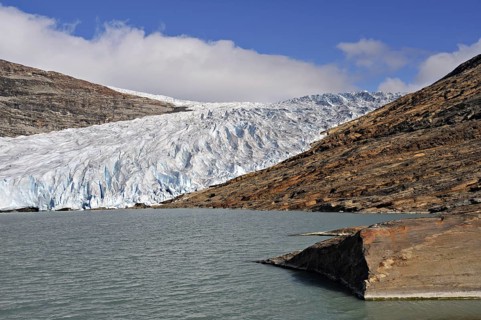 Glacier tongue or snout from the Svartisen ice-cap falls into a meltwater lake, Osterdalen, Norway,
