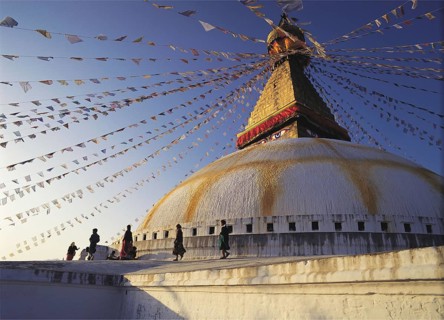 Worshippers parade around the Great Stupa in the Tibetan quarter at Boddnath or Bauda in the