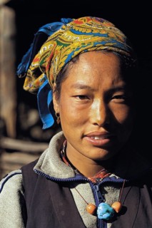 Portrait of pretty Bhotia girl with headscarf at the village of Chhinga in the Mustang region of