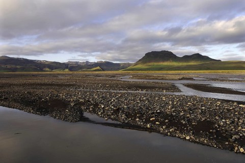 Evening light on the braids of the Syslalaekur river, with dappled light on distant hills, southern