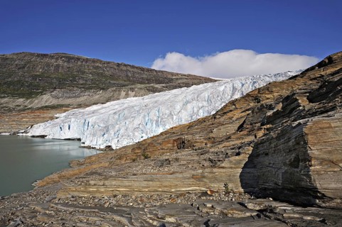 Glacier tongue or snout from the Svartisen ice-cap falls into a meltwater lake, Osterdalen, Norway,