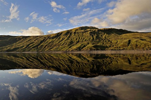 Hydro-electric reservoir at Loch Lyon with distant ridgeline, Glen Lyon, Perthshire, Scotland, UK