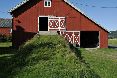 Bright red-painted barn at Stjordal, Norway, Europe