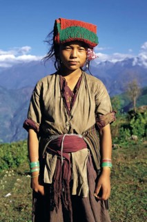 Bhote girl working as a porter in the Arun river district of east Nepal. The pad of material on her