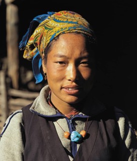 Portrait of pretty Bhotia girl with headscarf at the village of Chhinga in the Mustang region of