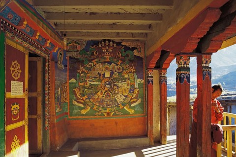 The entrance to the village gompa or shrine decorated with religious painting in the Tibetan style