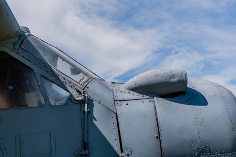 Air intake on top of radial engine cowling of antique airplane on display in public park