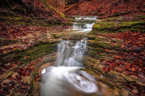 Waterfall in the Rautal forest in Jena in winter, Jena, Thuringia, Germany, Europe