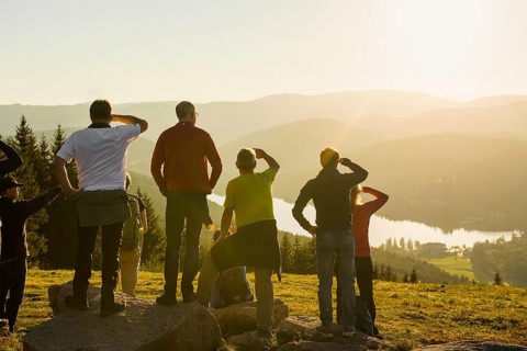 Hiking group, view from Hochfirst to Titisee and Feldberg, sunset, near Neustadt, Black Forest,
