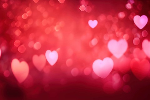 A romantic and dreamy background featuring heart-shaped bokeh lights, perfect for Valentine s Day