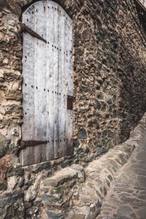 Door detail in Rupit, one of the best known medieval towns in Catalonia in Spain