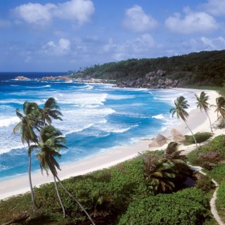 Waves in a storm on La Digue at Grand Anse beach, Seychelles, Africa