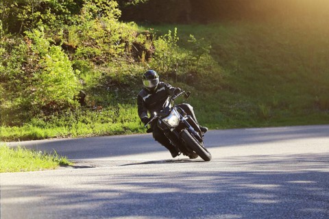Sporty motorcyclist on a trip into the countryside (Edenkoben Valley, Palatinate Forest)