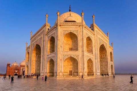 The majestic Taj Mahal during sunset with visitors in the foreground, Taj Mahal, Agra, India, Asia
