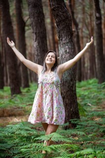 Young woman bathing in the forest (Shinrin Yoku), nature therapy from Japan