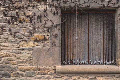 Window detail in Rupit, one of the best known medieval towns in Catalonia in Spain
