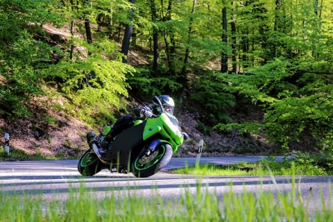 Sporty motorcyclist on a trip into the countryside (Edenkoben Valley, Palatinate Forest)