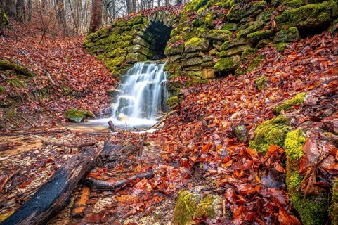 Waterfall in the Rautal forest in Jena in winter, Jena, Thuringia, Germany, Europe