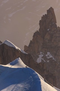 Mountaineer on glacier at sunrise, Mont Blanc Massif, French Alps, Chamonix, France, Europe