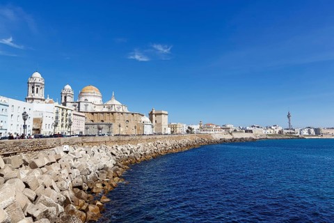 View of the dome and steeples of Cadiz Cathedral, Cathedral of the Holy Cross above the sea,