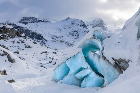 Glacier tongue in front of a mountain peak, snow, winter, Morteratsch glacier, Pontresina, Engadin,