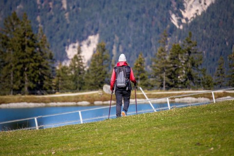 Woman hiking at the Kaltwassersee lake in Seefeld, Tyrol