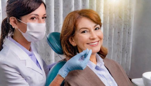 AI generated, dentist treating a middle-aged woman, dentist, blonde, 30, 35, years, dental