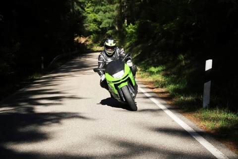 Sporty motorcyclist on a trip into the countryside (Edenkoben Valley, Palatinate Forest)