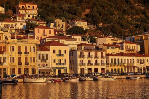 The harbour with sailing boats shines in the golden light of the sunset, Gythio, Mani, Peloponnese,