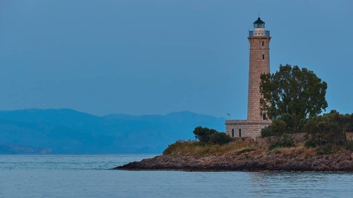 Lighthouse on the coast with trees at dusk, Gythio, Mani, Peloponnese, Greece, Europe