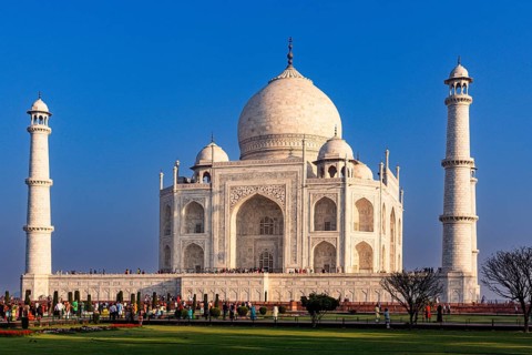 The imposing Taj Mahal surrounded by crowds under a clear sky during the day, Taj Mahal, Agra,