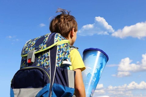 Child on the way to his first day of school, (Mutterstadt, Rhineland-Palatinate)