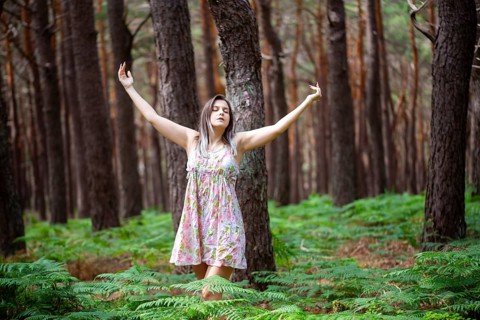 Young woman bathing in the forest (Shinrin Yoku), nature therapy from Japan