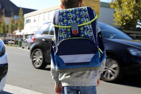 Schoolchild in road traffic, Mutterstadt, Rhineland-Palatinate