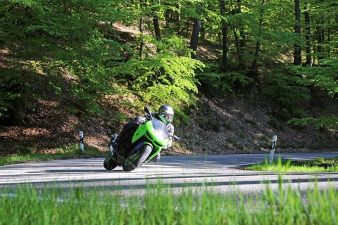 Sporty motorcyclist on a trip into the countryside (Edenkoben Valley, Palatinate Forest)