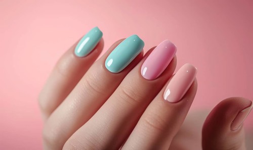 Female hand with pink and blue nail design. Nail polish manicure AI generated